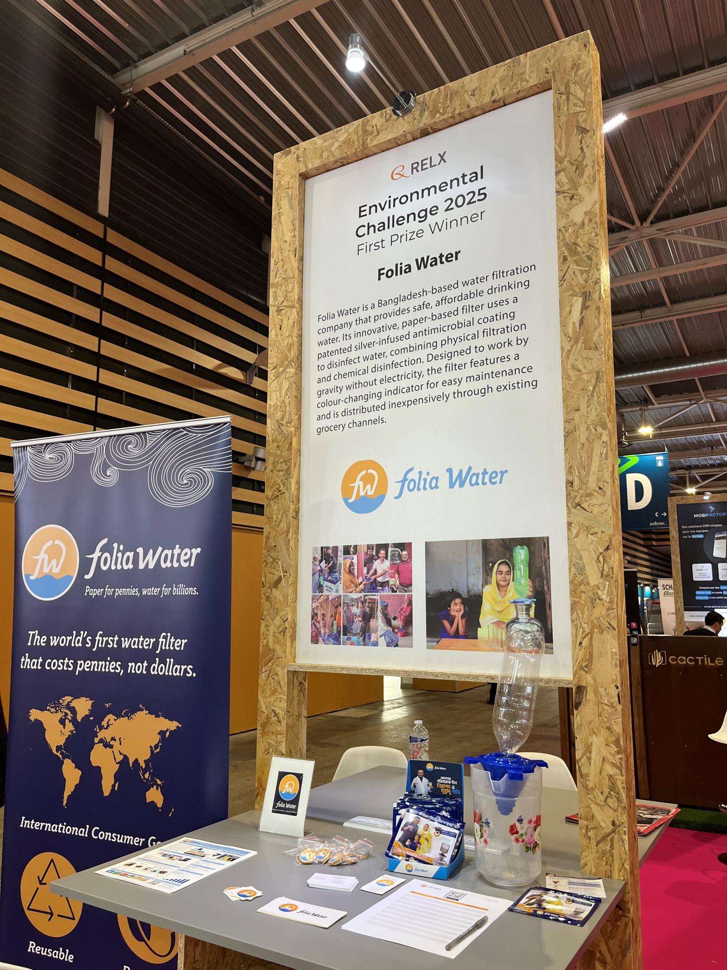Image of Folia Water stand at Pollutec featuring a banner and water filter equipment